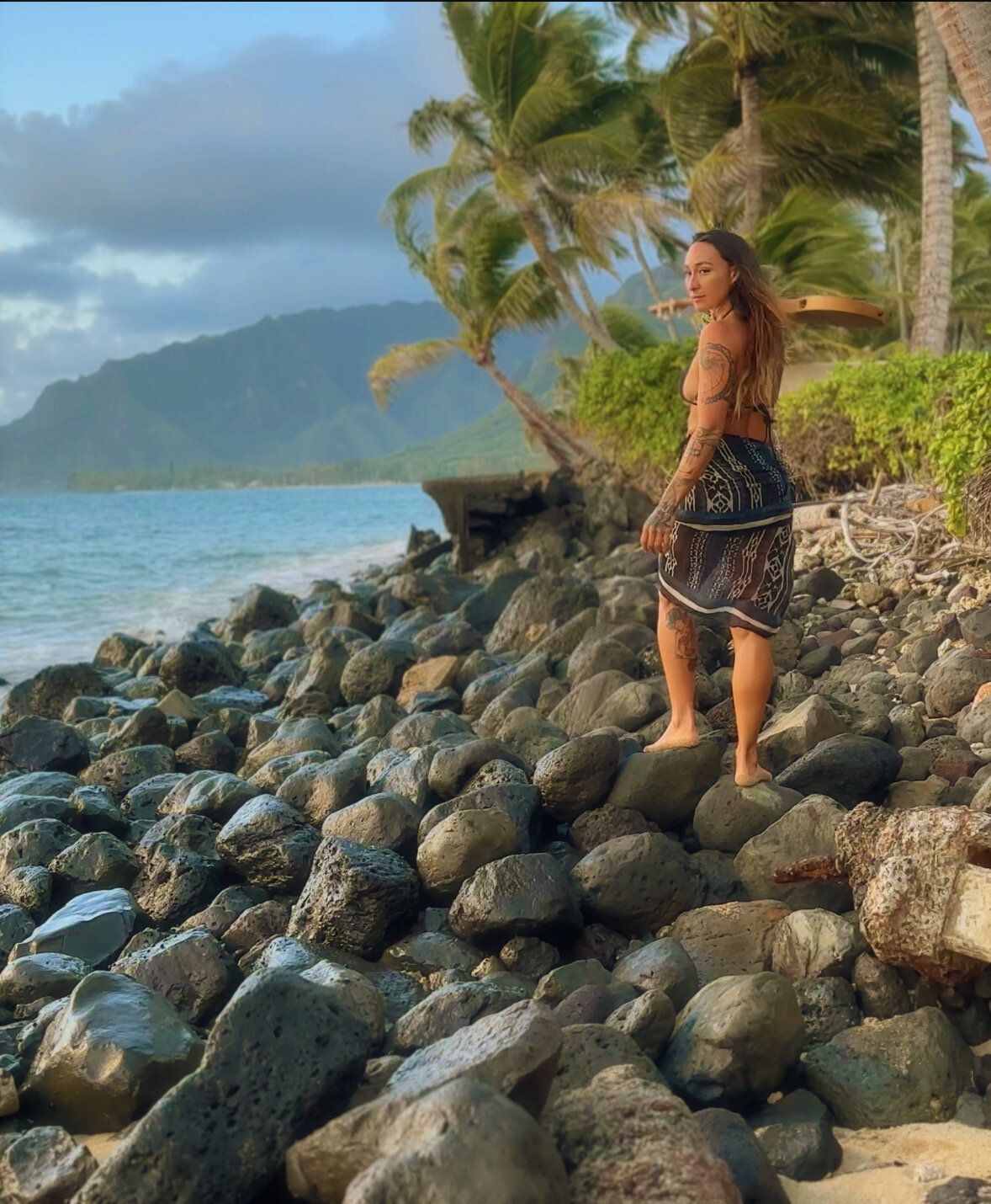 TIHANE on a rocky shoreline, looking back