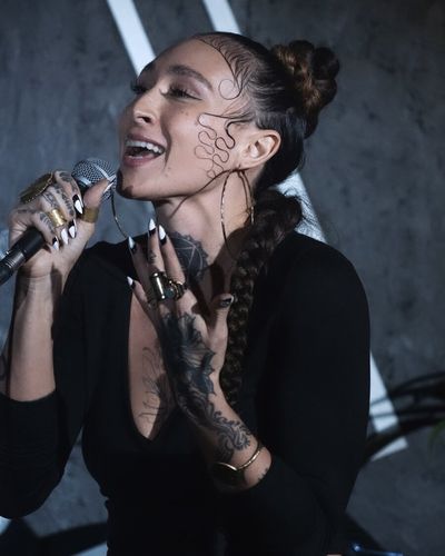 TIHANE singing on stage
